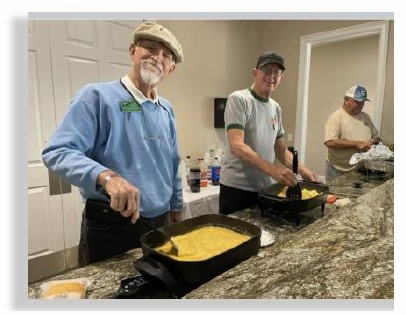 Members cooking breakfast